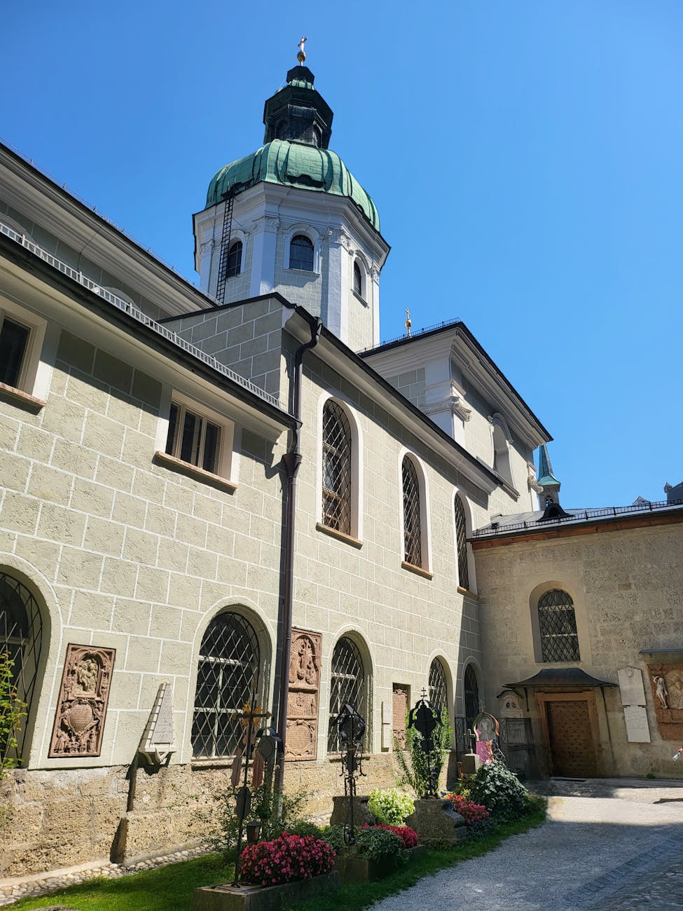 Salzburg Old Town cobblestone streets with Hohensalzburg Fortress overlooking the historic Austrian city.